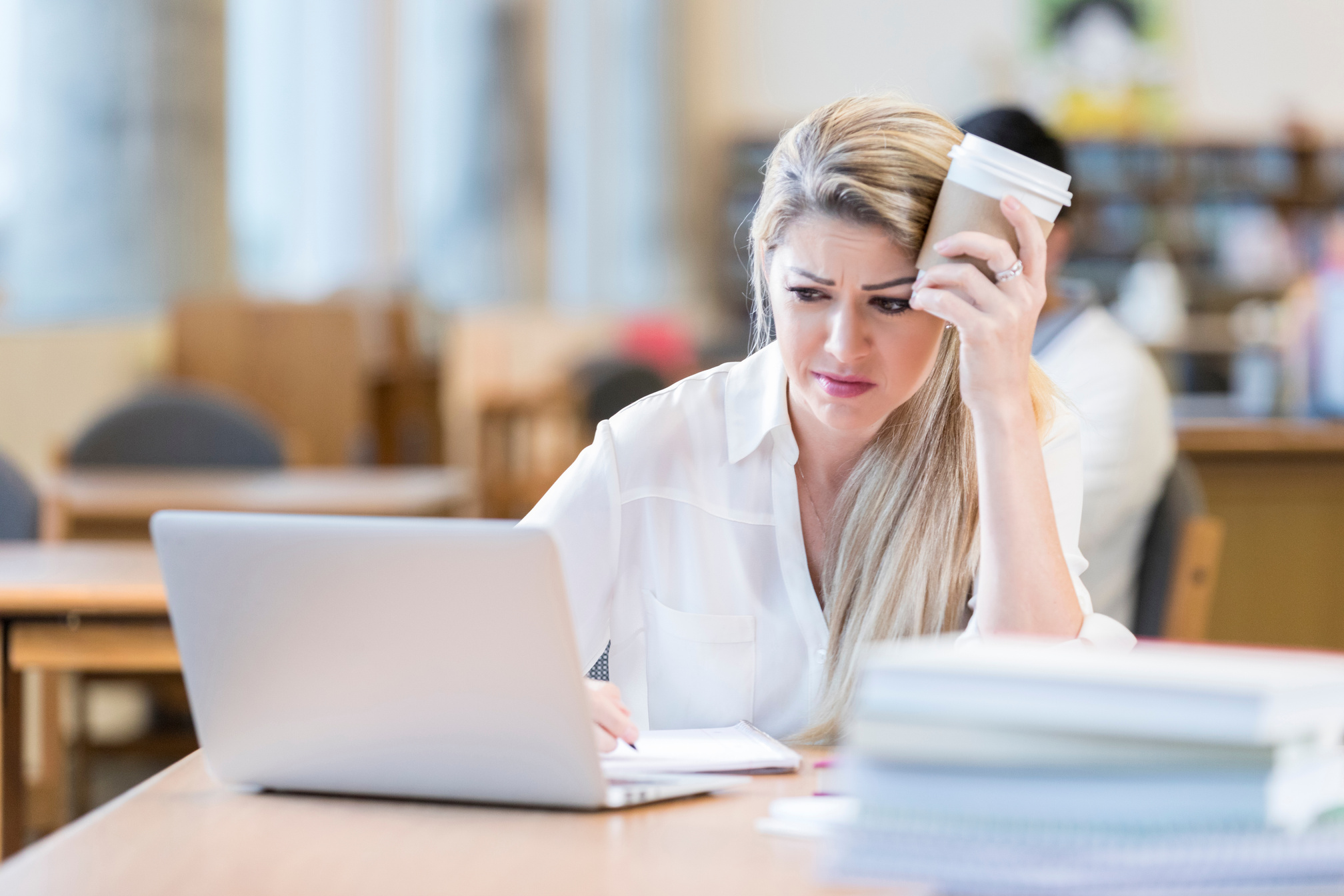 Frustrated businesswoman using computer at work